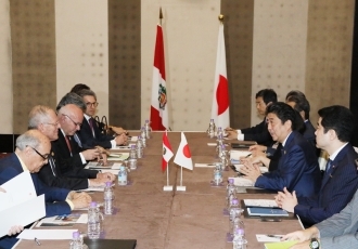Prime Minister shaking hands with the President of Peru