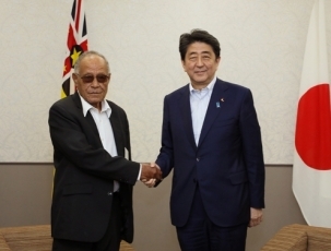 Prime Minister shaking hands with the Acting Premier and <br>Minister of Infrastructure of Niue