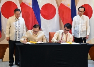 Mr. Kono and H.E. Mr. Locsin who sign notes concerning a provision of a loan to develop a road network