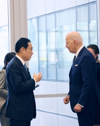 Prime Minsiter Kishida who has a short discussion with President Biden while standing