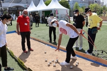 (photo 12) Visitors enjoying petanque, a ball game originated from France