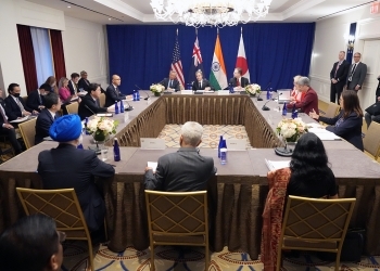 Four Ministers who have a seat at a table and have a talk