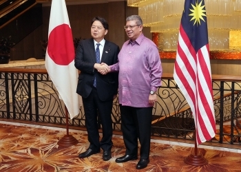 Foreign Minister Hayashi shakes hands with Malaysian Foreign Minister Saifuddin