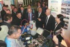 Photo of Taiyo Shoji employees and local people explaining CFC countermeasures in Malaysia