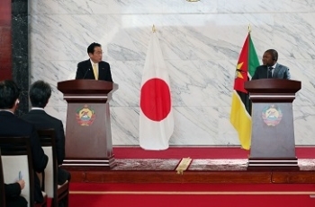 Two leaders who attend a joint press announcement standing behind the lectern