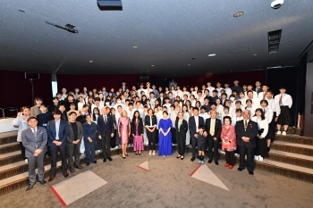 A group photo of the G7 leaders' spouses and attendees of the symposium