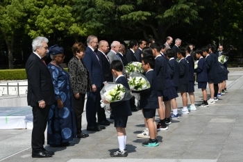 Leaders of the Invited Countries and Heads of International Organizations receiving flowers from children