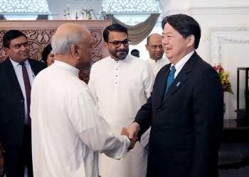Foreign Minister Hayashi shakes hands with Prime Minister Gunawardena
