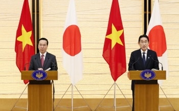 Two leaders who attend a joint press announcement standing behind the lectern