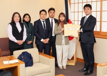 Members of the Myanmar community residing in Japan, hands over a