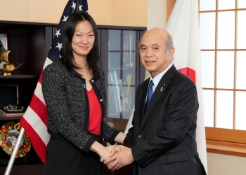 Mr. Tsuge shaking hands with Amb Julie TURNER