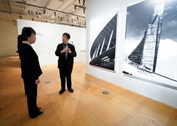Foreign Minister Kamikawa is listening the explanation of the architect exhibition by Kenzo Tange and by Kengo Kuma