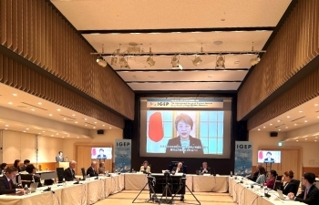 Conference room, Foreign Minister Ms. Kamikawa, delivering speech, on the screen