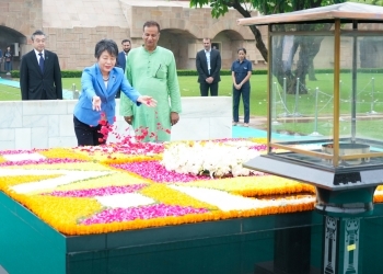 Foreign Minister Kamikawa sowing flower petals on the Raj Ghat