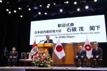 Prime Minister Mr. Ishiba is talking on the stage
