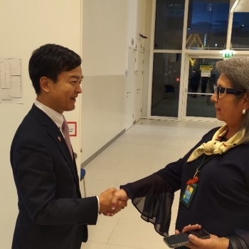 State Minister Miyaji shaking hands with Health Minister Reyes