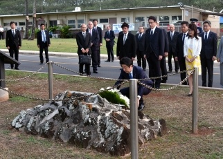 Prime Minister Abe lays flowers at the monument to former Japanese Imperial Navy Lieutenant Colonel Fusata Iida