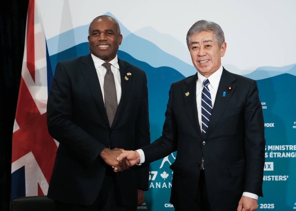 Foreign Minister Mr. Iwaya is shaking hands wtih the Rt Hon David LAMMY, Secretary of State for Foreign, Commonwealth and Development Affairs of the United Kingdom