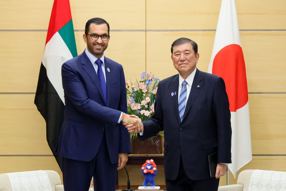 Prime Minister ISHIBA shaking hands with Dr. Jaber, Minister of Industry and Advanced Technology and Special Envoy to Japan of the UAE