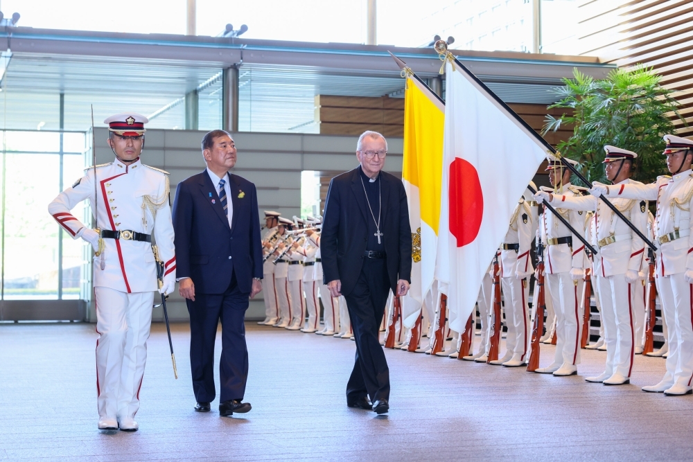 Prime Minister ISHIBA and His Eminence Cardinal PAROLIN, Secretary of State of the Holy See, walking during the honors ceremony conducted by the honor guard