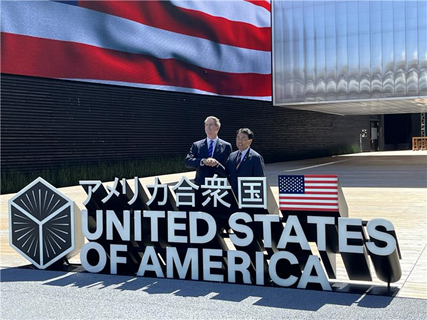 Mr. Akazawa shaking hands with Mr. Bessent in front of the U.S. Pavilion at the EXPO 2025 Osaka, Kansai