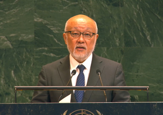Ambassador Uemura giving a statement speech on the conference