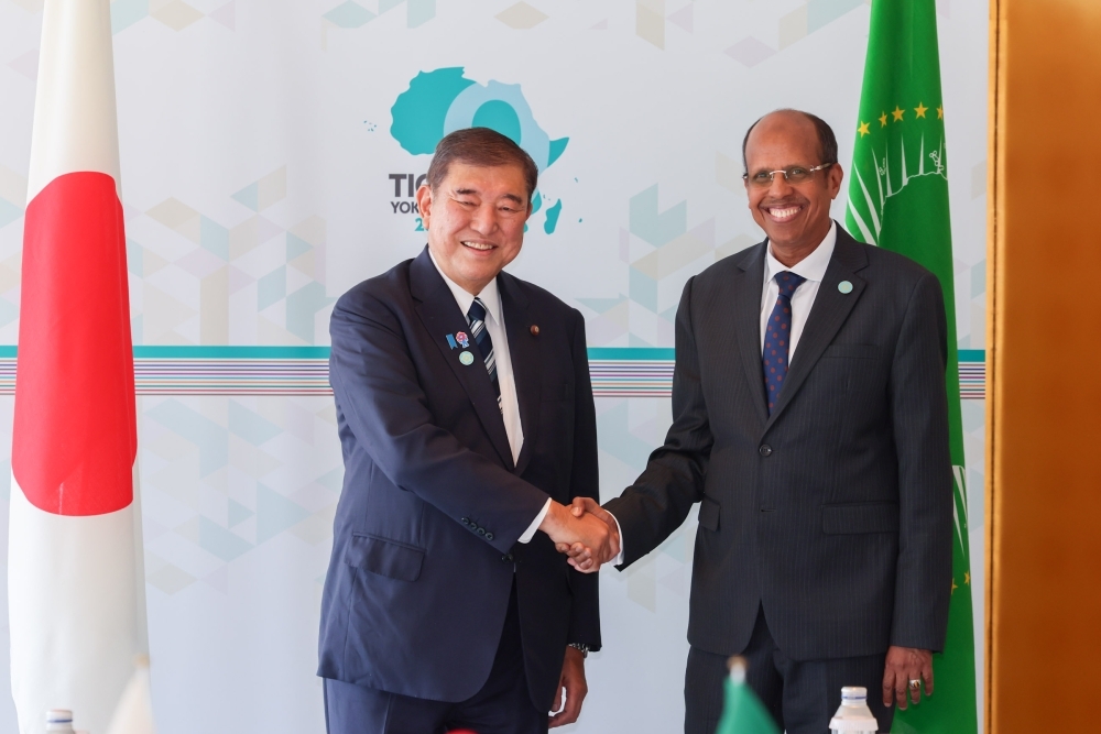 Prime Miniser Ishiba is shaking hands with Mr. Mahmoud Ali YOUSSOUF, Chairperson, African Union Commission