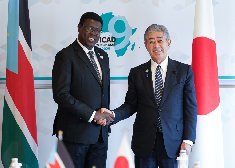 Minister IWAYA shaking hands with Minister Semaya