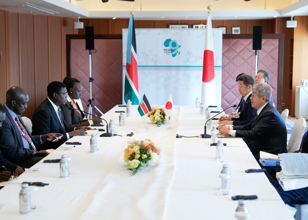 Minister IWAYA talking with Minister Semaya at the meeting