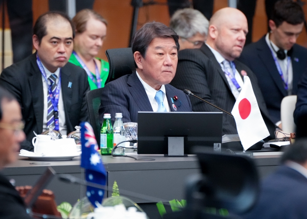 Minister MOTEGI making a remark during ASEAN Plus Three (Japan-China-Republic of Korea) Summit
