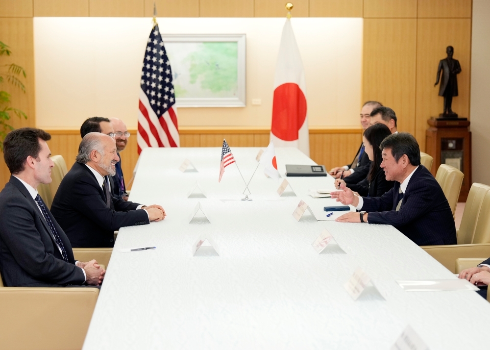 Minister MOTEGI talking with Secretary Lutnick
