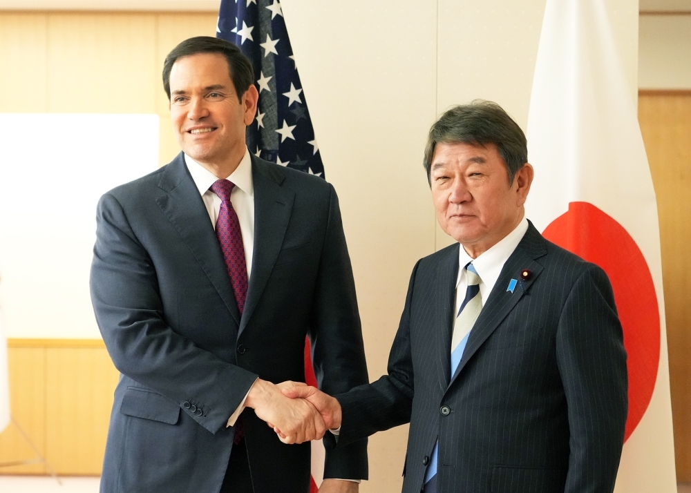 Foreign Minister Motegi shaking hands with Secretary of State Rubio