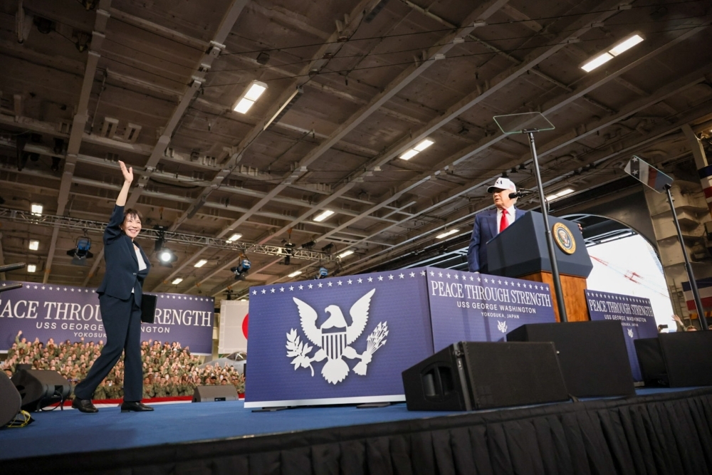 Prime Minister Takaichi waving to the members of the U.S. forces