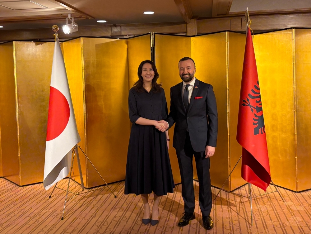 Parliamentary Vice-Minister ERI shaking hands with Ambassador of Albania to Japan