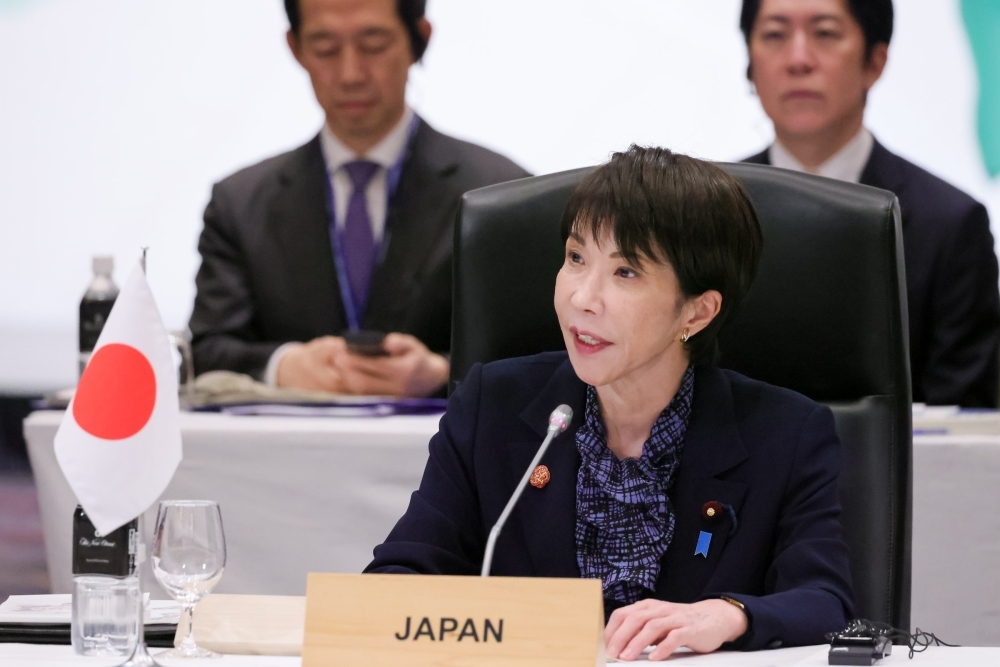 Prime Minister TAKAICHI making a speech at the Summit
