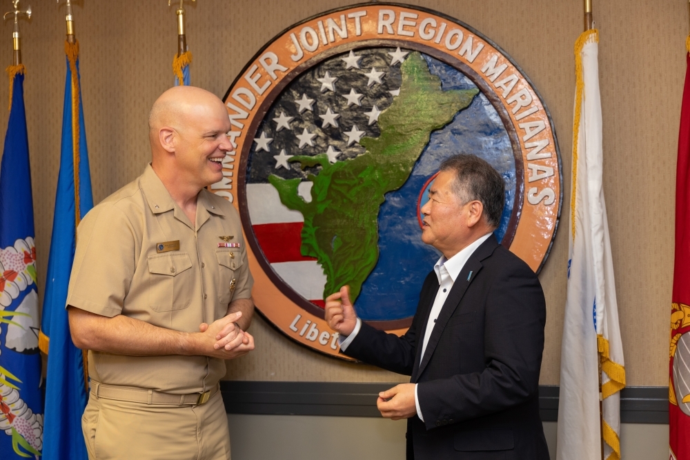 Special Advisor OUE talking with Rear Admiral Brett Mietus, Commander, Joint Region Marianas