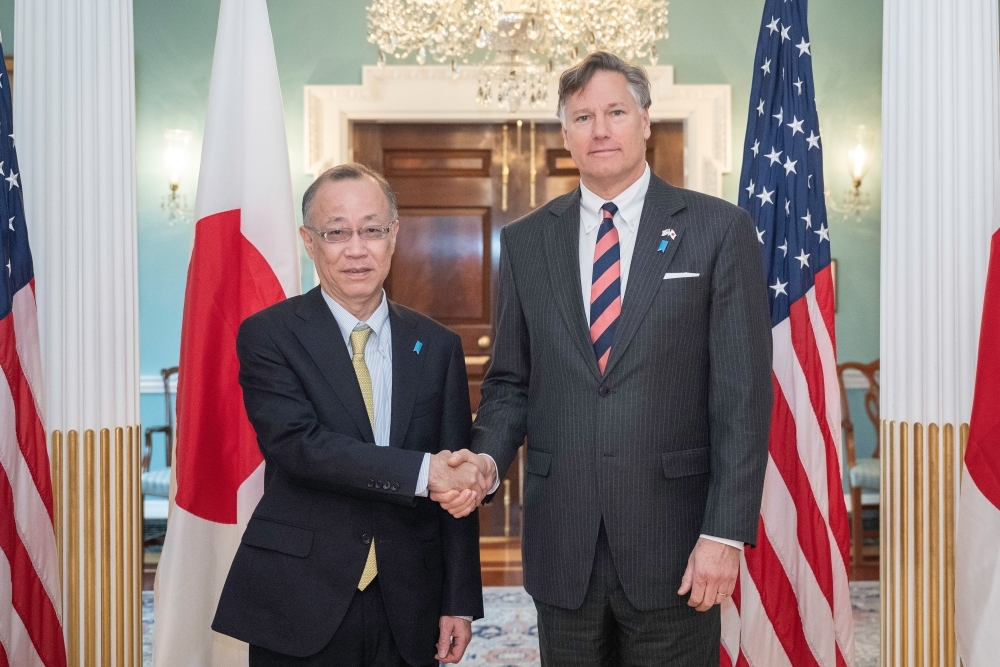 Vice Minister FUNAKOSHI shaking hands with the Honorable Christopher Landau, Deputy Secretary of State of the United States of America