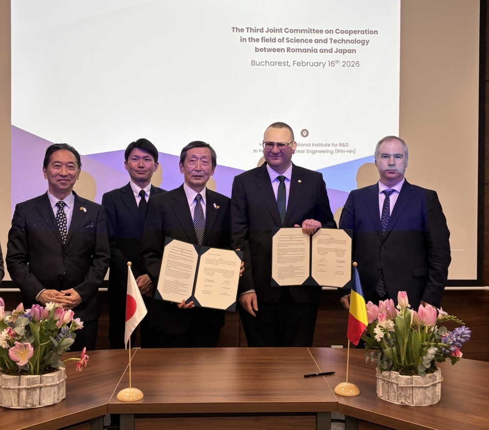 Ambassador KAWAMURA and Mr. ALEXANDRU President of the National Authority for Research of Romania holding the signed documents 