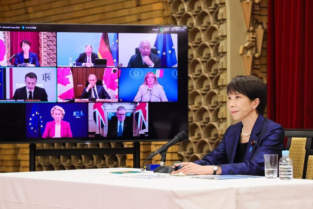 Prime Minister Takaichi attending the G7 Leaders' Video Conference. G7 Leaders are on the screen.