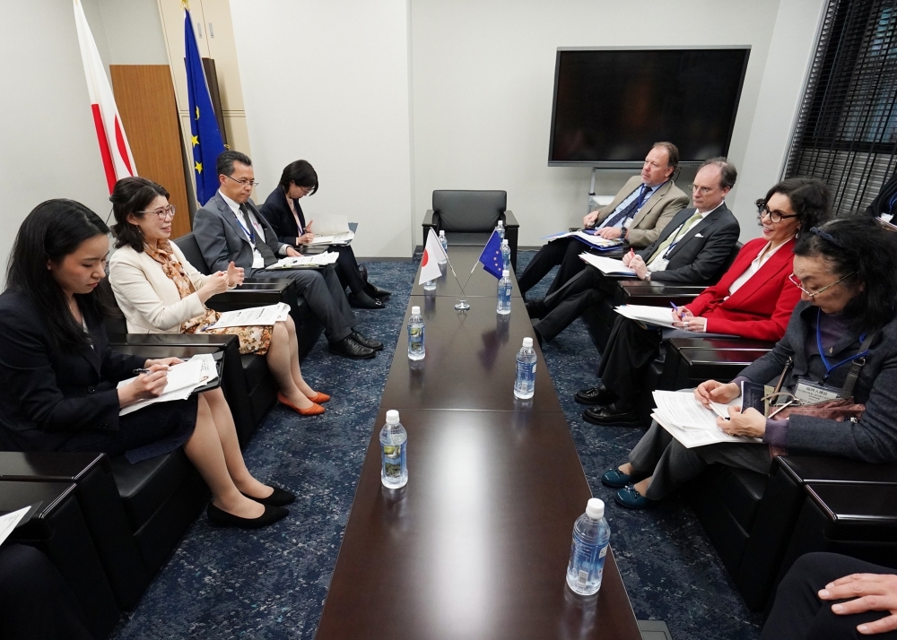 State Minister KUNIMITSU talking with Commissioner LAHBIB