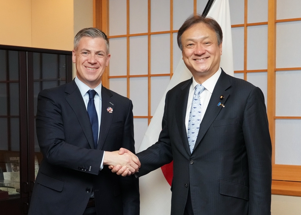 State Minister HORII shaking hands with Senator Jim Banks, United States