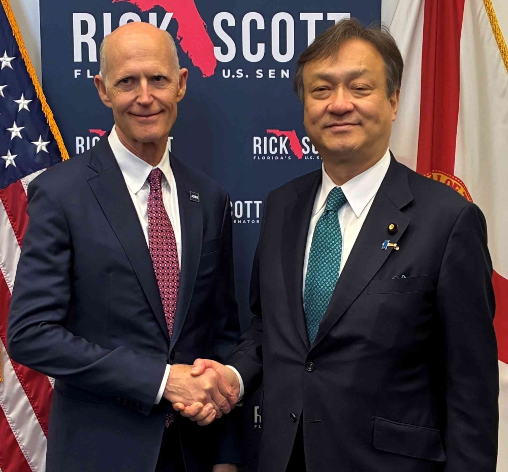 State Minister HORII shaking hands with Senator Rick Scott