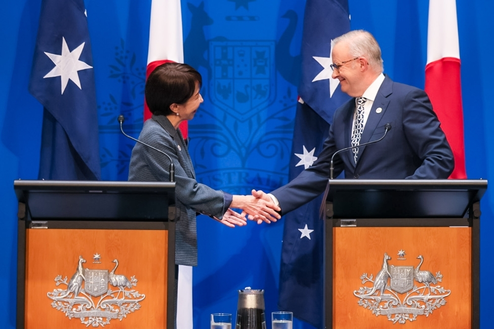 Prime Minister Takaichi shaking hands with Prime Minister Albanese