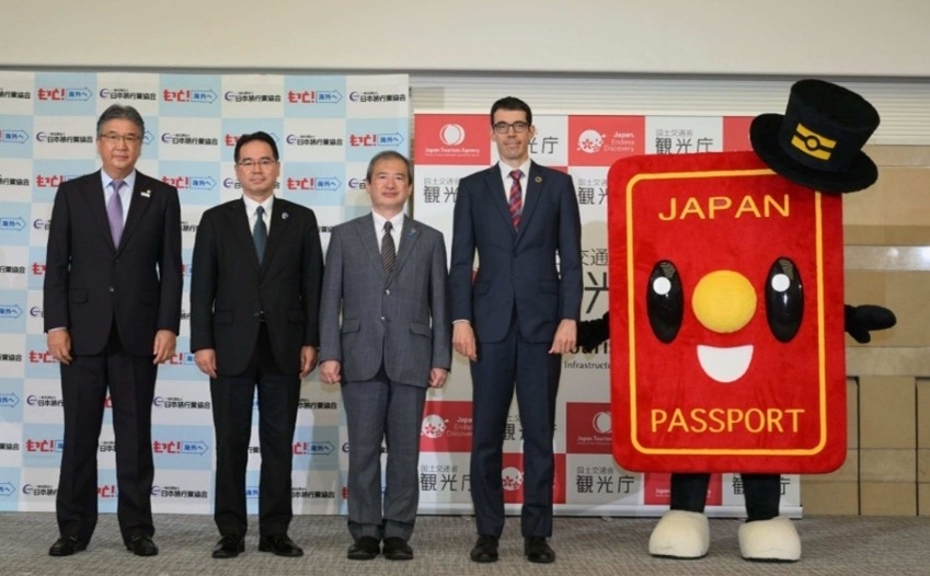 Group photo of four panelists at a joint press conference photo session