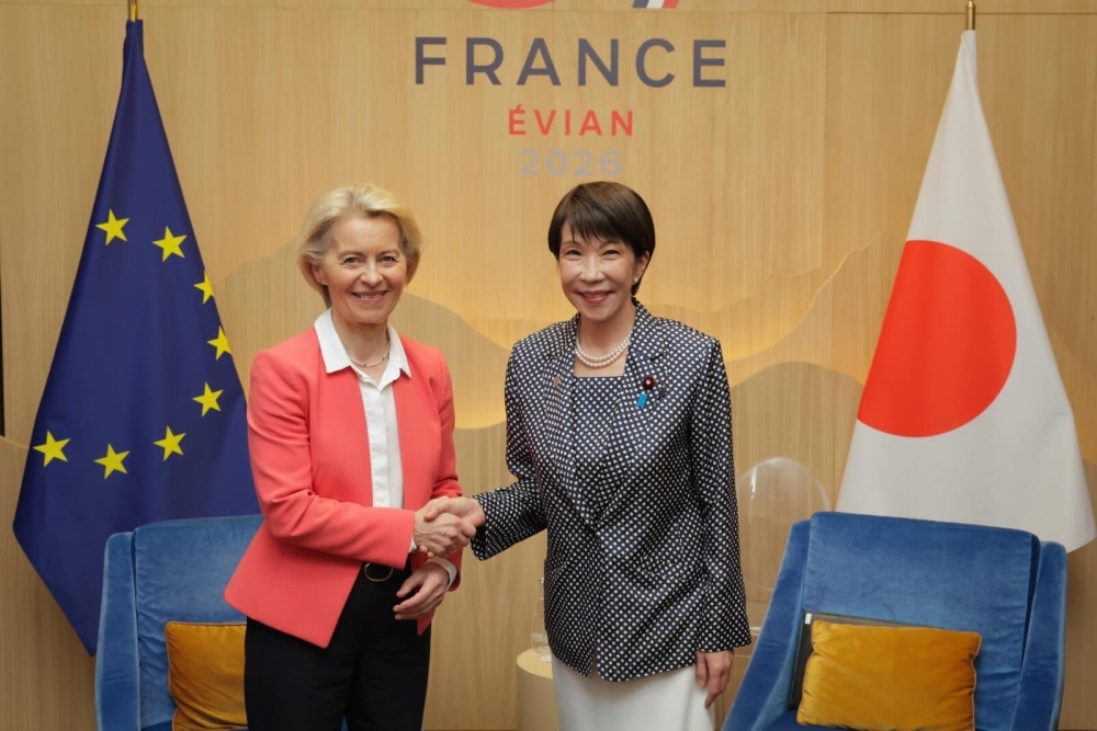Prime Minister Takaichi shaking hands with President von der Leyen of the European Commission