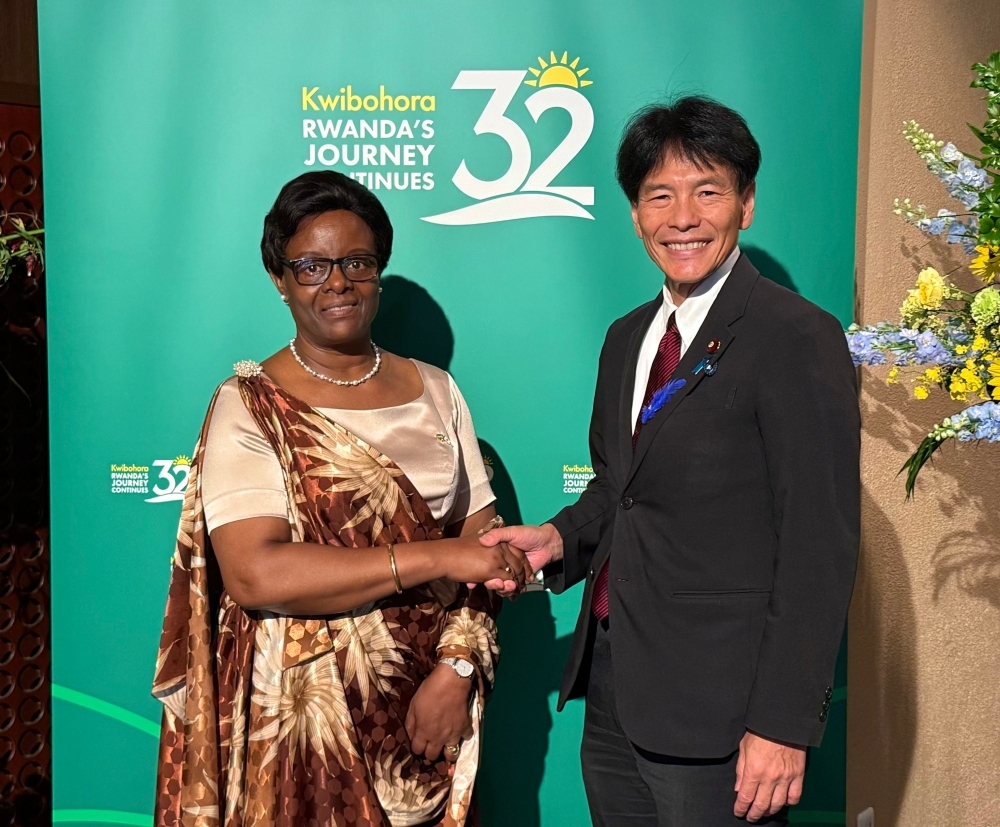 Parliamentary Vice-Minister Shimada shaking hands with Ambassador Marie Claire Mukasine