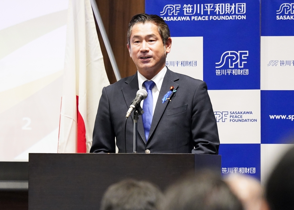Parliamentary Vice-Minister ONISHI giving a greeting at the Japan-Libya Economic Forum (close-up)