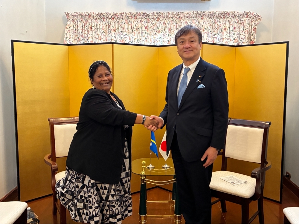 The handshake between State Minister HORII and Hon. Charmaine Eraidinomo Scotty, Minister for Health; Internal Affairs; Women and Social Development Affairs; People Living with Disabilities; the Naoero Museum and Heritage; and the Naoero Tourism Corporation of Naoero