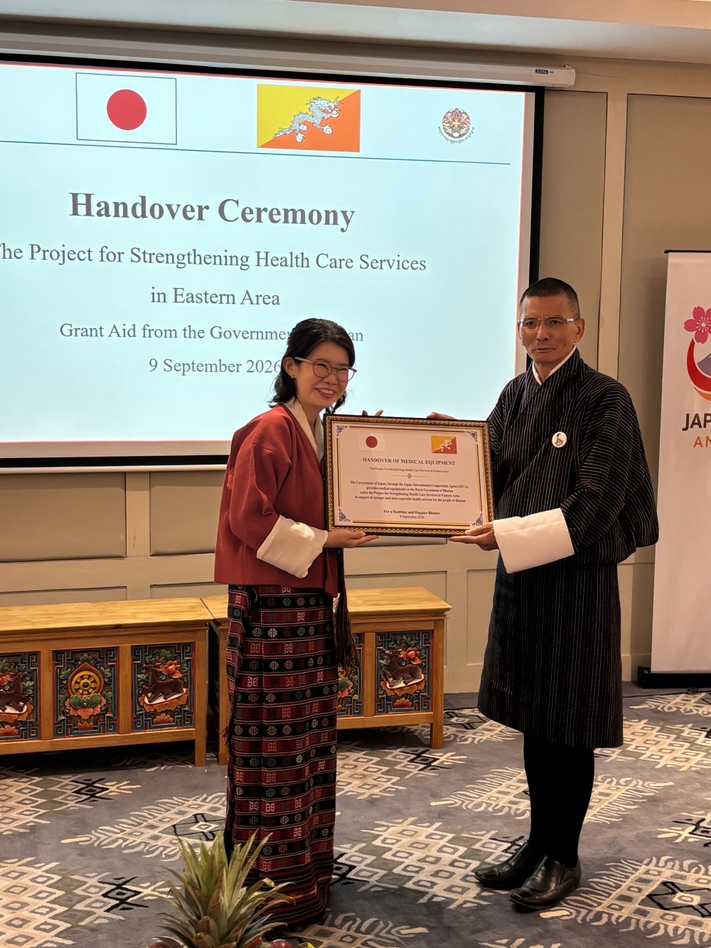 State Minister KUNIMITSU handed a grant aid Pnanel to H.E. Lyonpo Lekey Dorji, Finance Minister