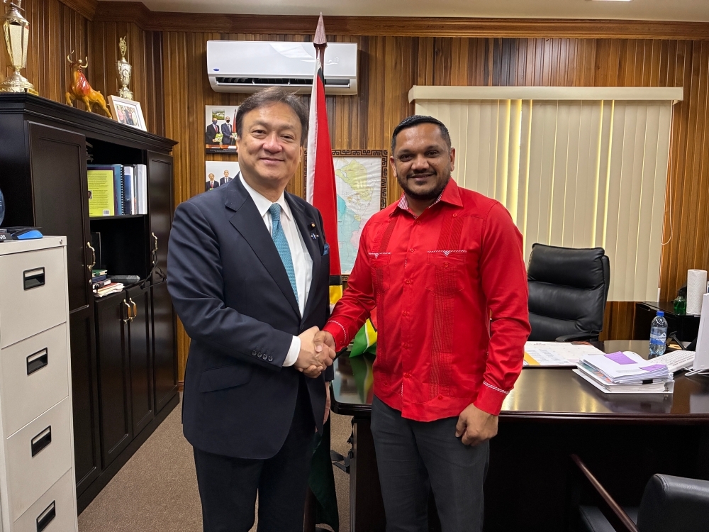 State Minister HORII shaking hands with Hon. Vickram Outar Bharrat, Minister of Natural Resources